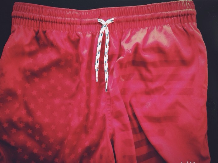 My hubby's weekend uniform...hypercolor swim trunks that show stars and stripes when wet.