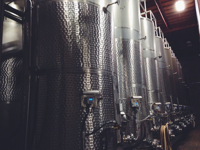 Fermenting tanks in the cellar are wrapped with cooling jackets (the textured bands you see) to help control temperatures and ensure proper fermentation for each style of juice