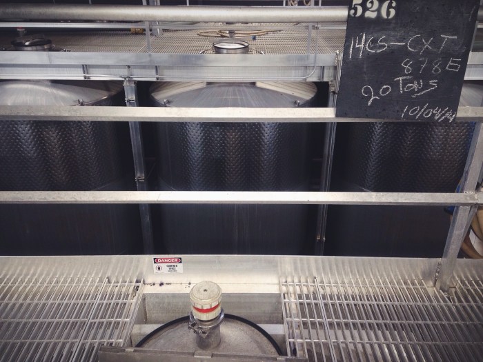 Helping with pump-overs, which literally pumps the juice back over the top of the tank to help reincorporate the skins that have been pushed to the top during fermentation