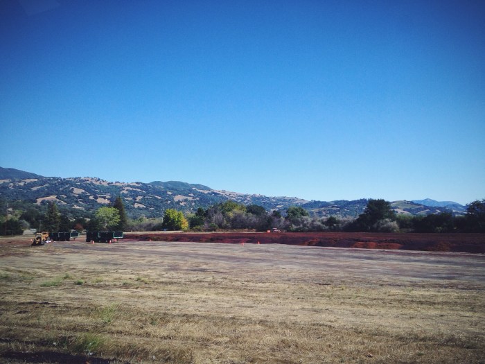 All of the pumice is brought here to this open field once it's done at the winery and turned several times a day until it is fertilizer, it is then brought back to the vineyards and worked into the soil