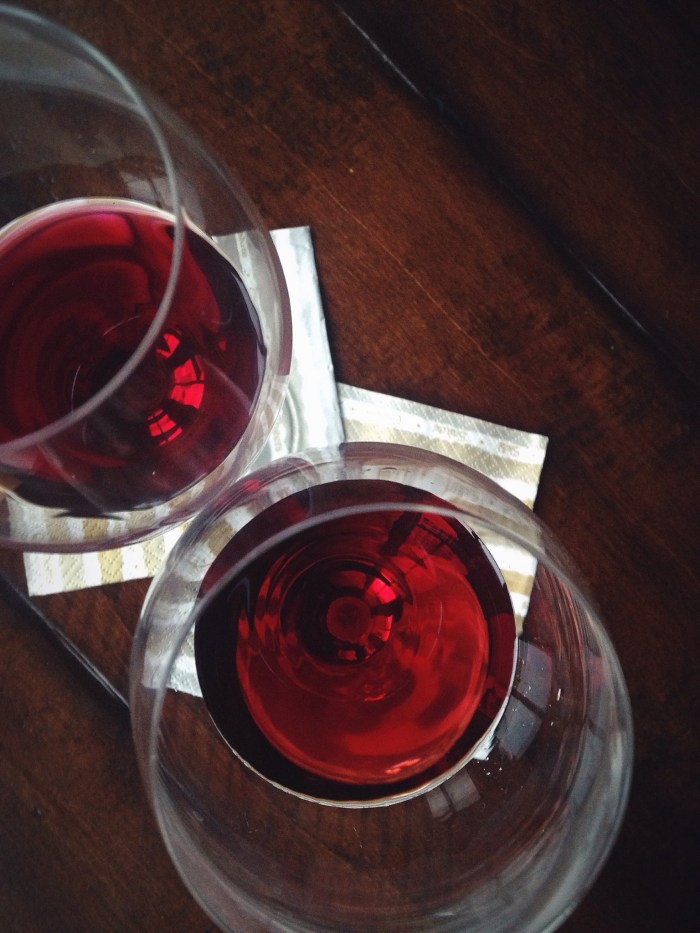 The Beaujolais is the slightly deeper red/purple glass on top