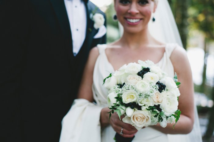 I love flowers but I didn't want to spend a huge portion of our budget on them. I opted for bouquets and boutineers for the bridal party but there wasn't another flower to be seen. I also saved money by not dictating the types of flowers I wanted to use. I just asked for light/white with some dark pops of navy if possible. 