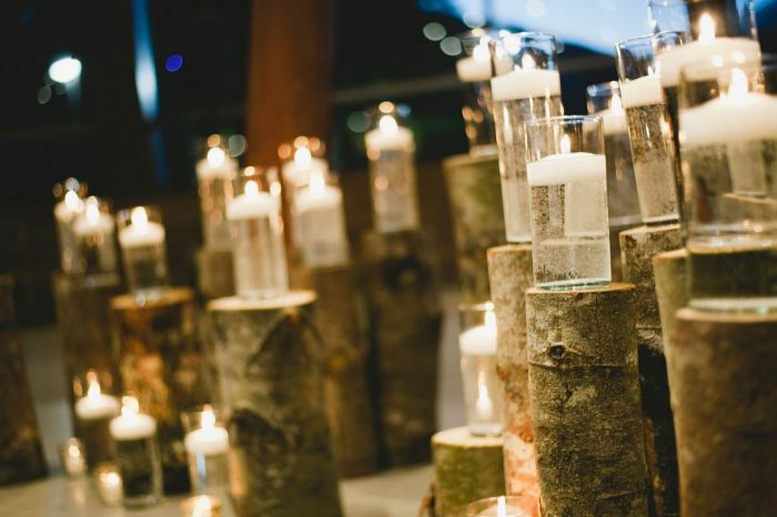 Instead of flowers we used stumps and candles to create an alter space filled with twinkly lights.