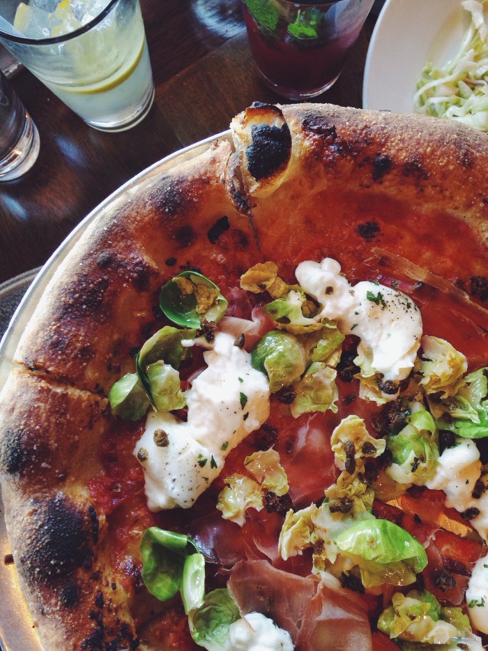 Woodfired pizzas. This one was speck, fried capers, burrata and brussel sprout leaves.