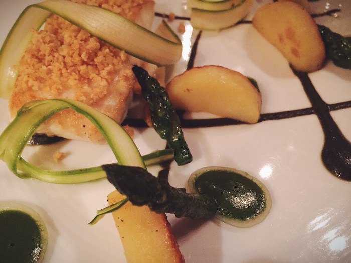 Wild Alaskan halibut with asparagus, spring onion, confit Yukon Gold potato, and almond