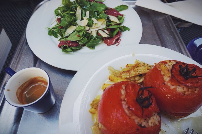 A delicious courtyard lunch of stuffed tomatoes and carpaccio