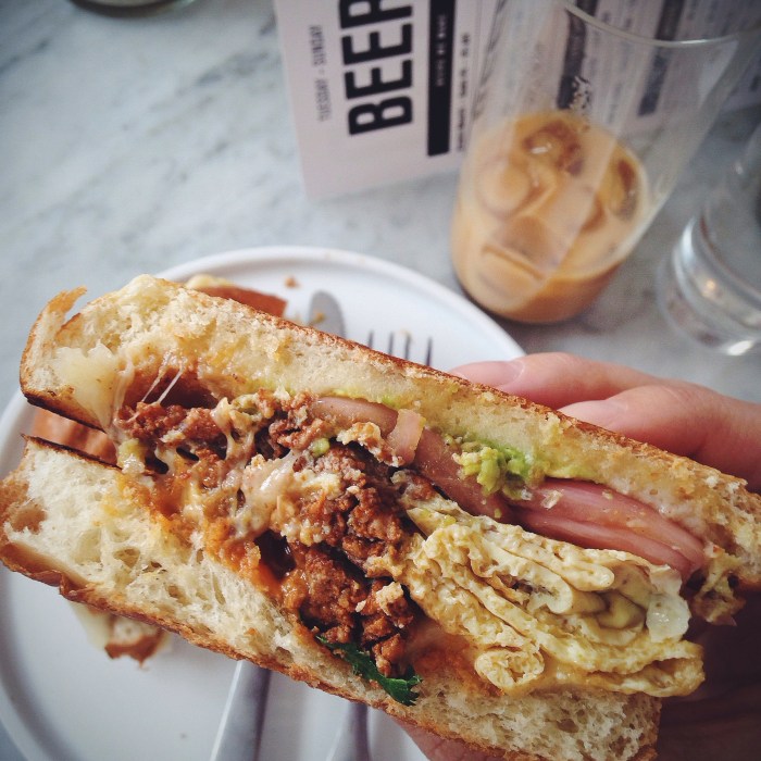 This breakfast sando is beyond...housemade chorizo and pickled red onions, YAAASSSS!