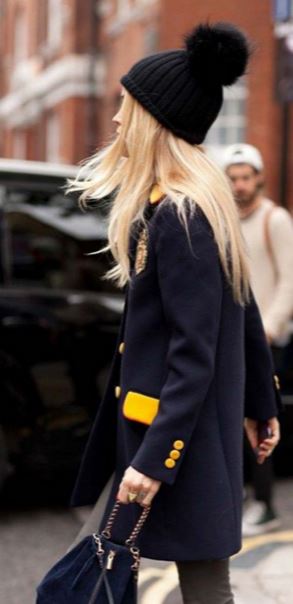 The poof beanie is the perfect way to add whimsy to a winter outfit